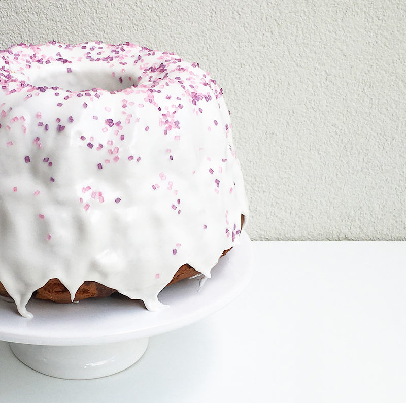 Modern version of a marble cake with royal icing and sprinkles